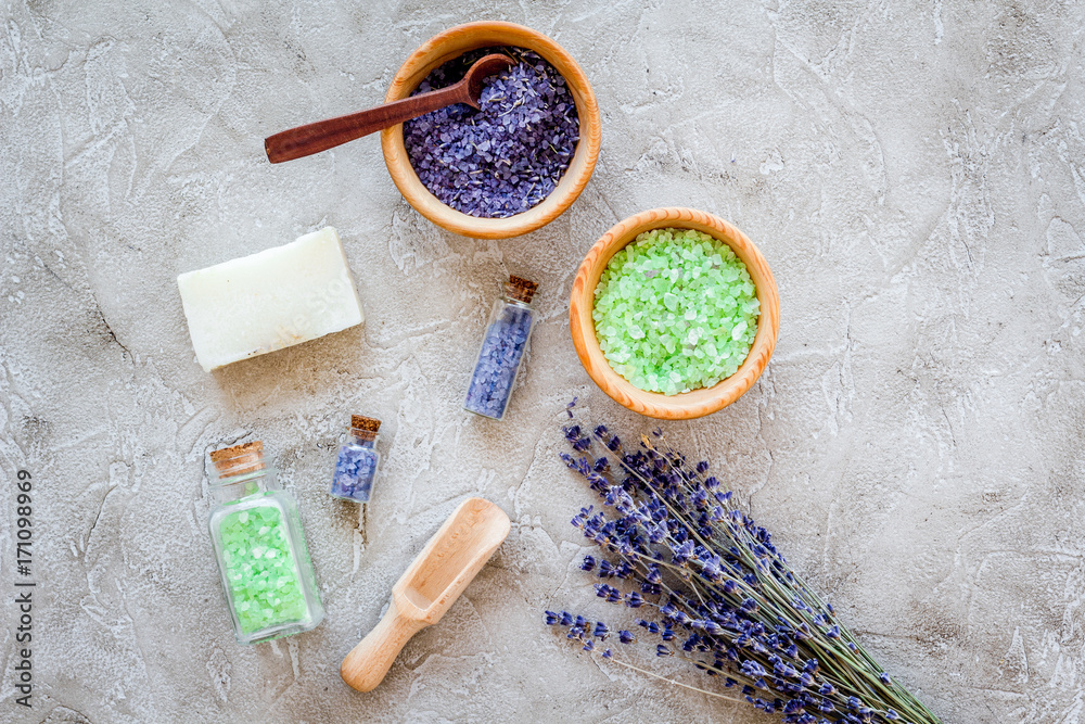 home spa with lavender herbs cosmetic salt for bath and soap on stone desk background top view home spa with lavender herbs cosmetic salt for bath and soap on stone desk background top view