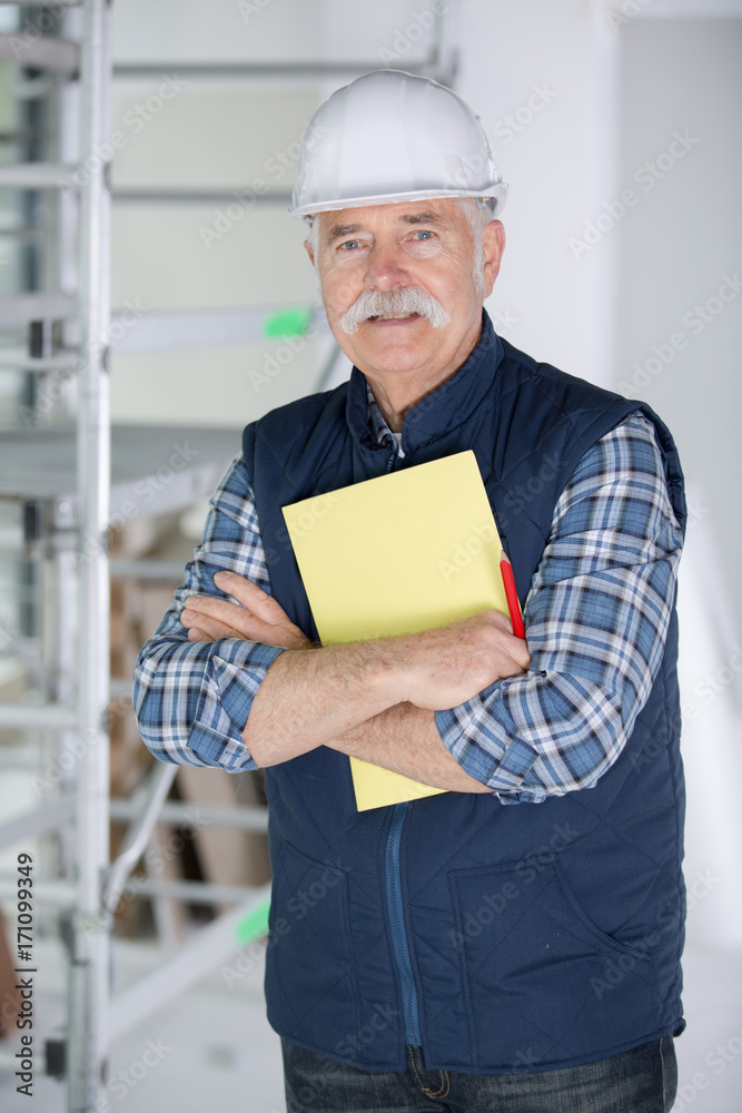 technician writing on clipboard