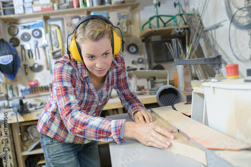 female carpenter working in workshop