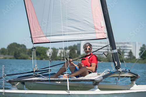 man sailing and dreams in a summer day