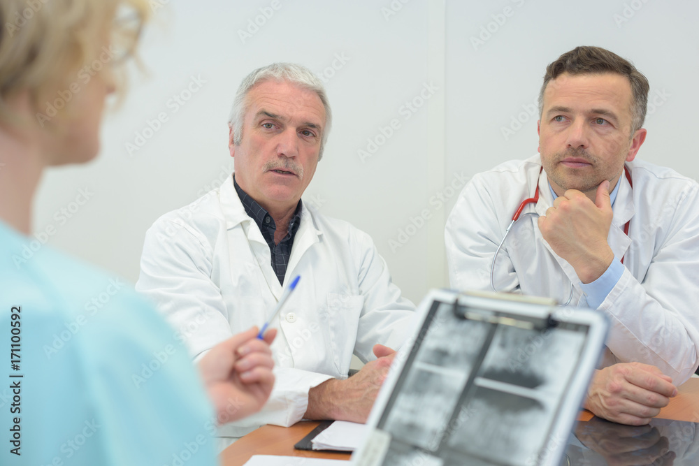 team of doctors having a meeting in the meeting room team of doctors having a meeting in the meeting room