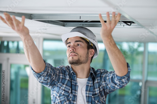 carpenter at work with roof construction