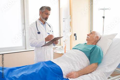 doctor talking to patient in hospital