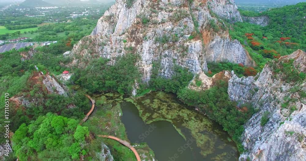 stone mountain around the lake at Hin Ngu mines stone.suspension bridge conect to wooden bridge across the lake