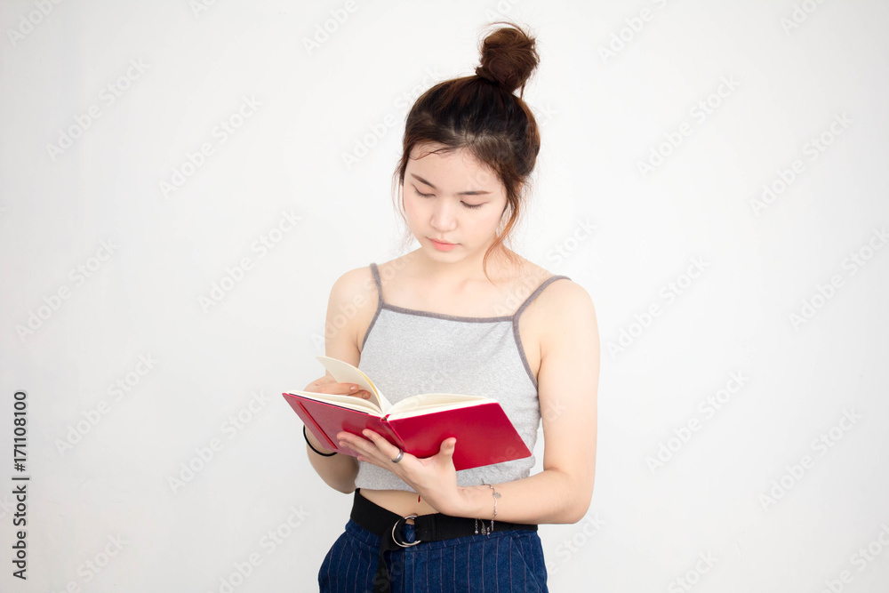Portrait of thai adult beautiful girl read red book Portrait of thai adult beautiful girl read red book