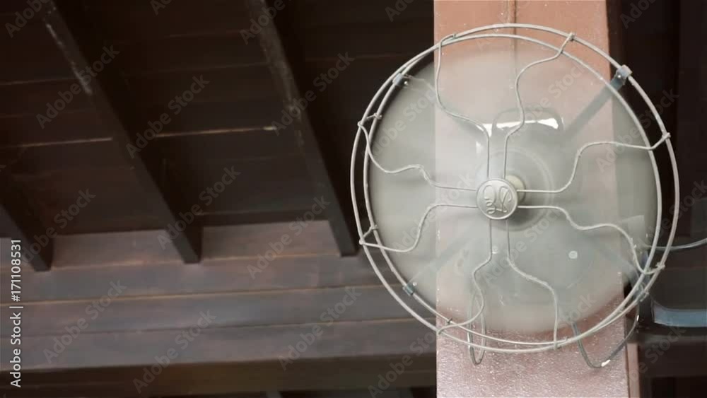 Antique wall fan in room