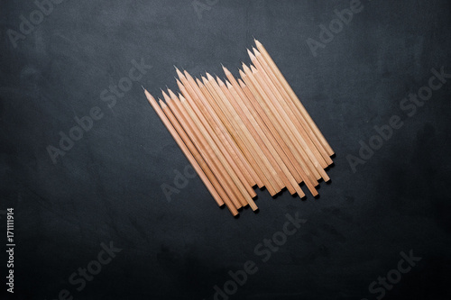 School equipment and supplies for work on a black background.  Education concept.  Top view.