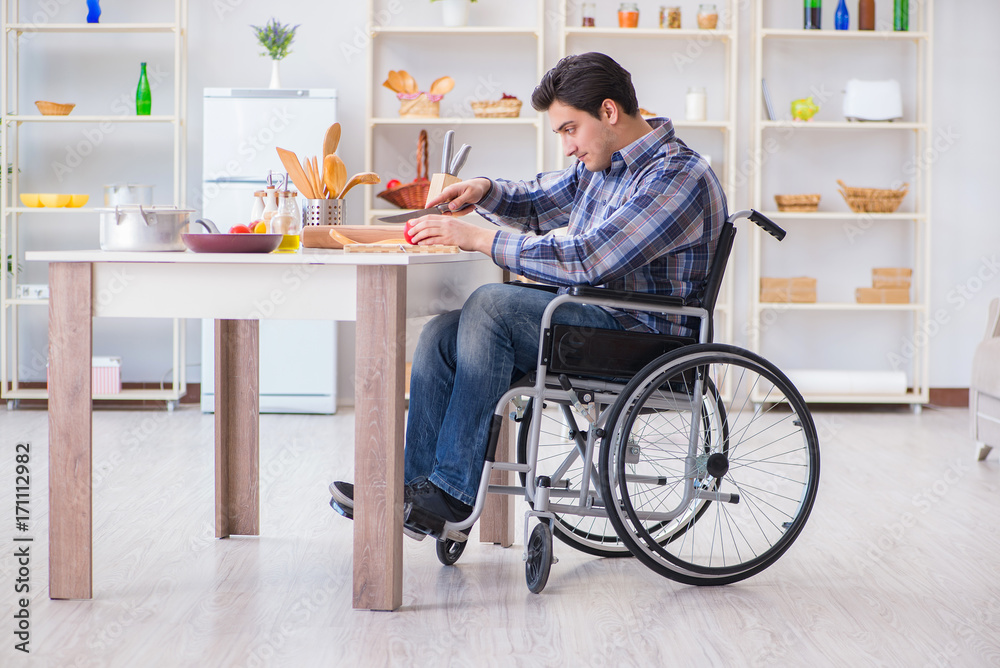Young disabled husband preparing food salad Young disabled husband preparing food salad