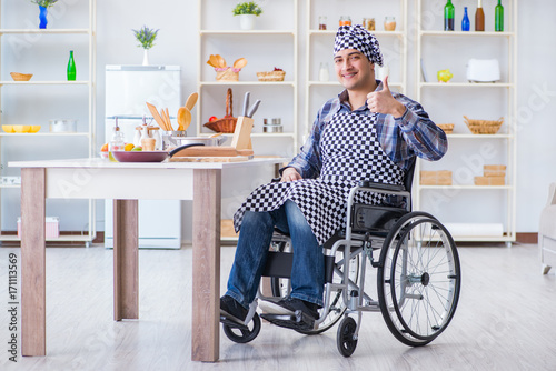 Disabled young man husband working in kitchen © Elnur