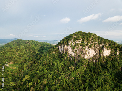 Aerial view, tropical forest on the mountain with blue sky