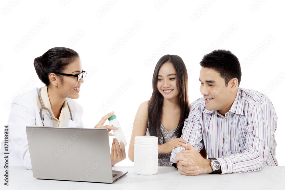 Doctor explains a medicine with her patient Doctor explains a medicine with her patient