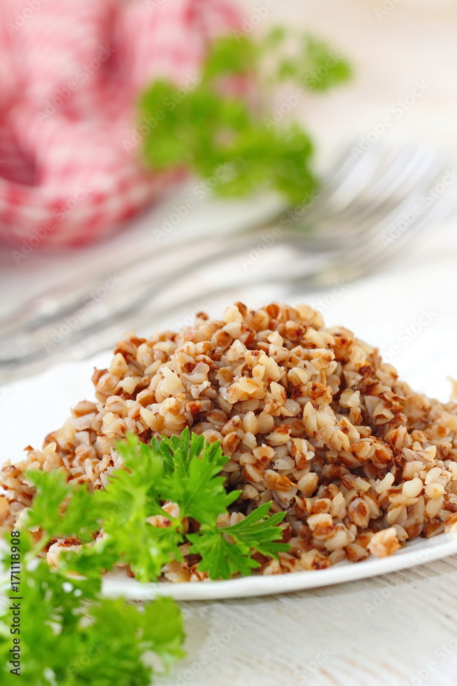 Buckwheat on a plate and fresh vegetables Buckwheat on a plate and fresh vegetables