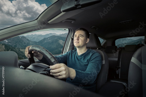 Man driving a car © Andrii IURLOV