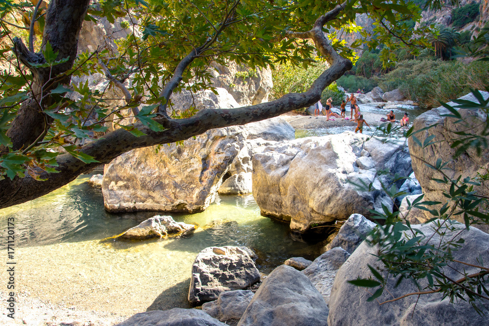 View of Kourtaliotis river and canyon near Preveli beach at Libyan sea, river and palm forest, southern Crete, Greece View of Kourtaliotis river and canyon near Preveli beach at Libyan sea, river and palm forest, southern Crete, Greece