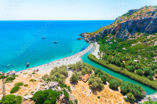 Canvastavla View of Preveli beach at Libyan sea, river and palm forest, southern Crete , Gre