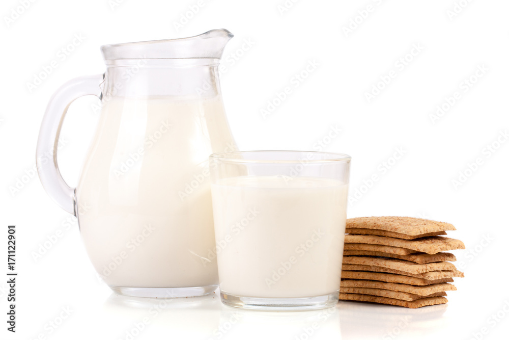 jug and glass of milk with stack of grain crispbreads isolated on white background jug and glass of milk with stack of grain crispbreads isolated on white background