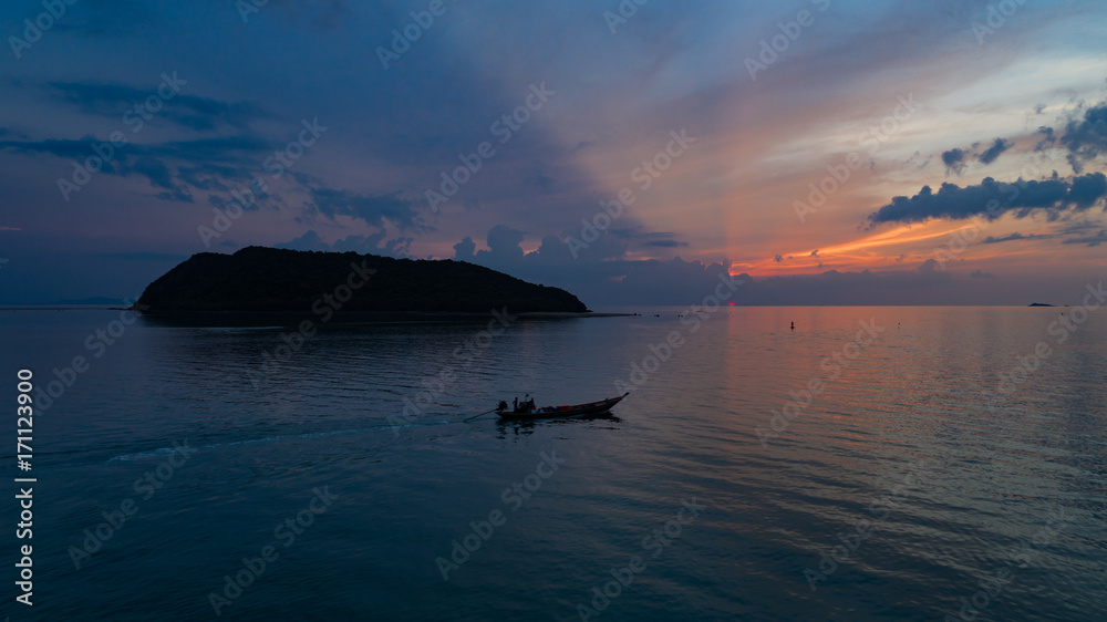 fisherman boat in silhouette scene