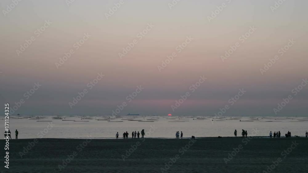 The Time-lapse of sunset on beach at Qiaotouhaitan Park in Tainan, Taiwan. The Time-lapse of sunset on beach at Qiaotouhaitan Park in Tainan, Taiwan.