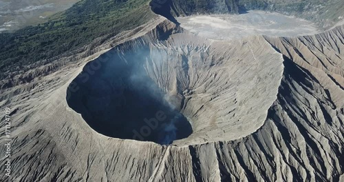 Mountain Bromo active volcano crater in East Jawa, Indonesia. Top view from drone fly. 4K footage photo