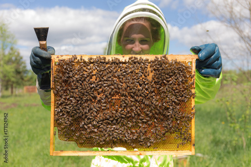 bee-keeper with a honeycomb