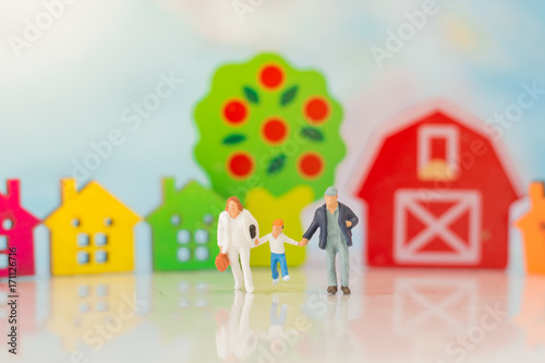 Miniature family with children using as background family day concept.