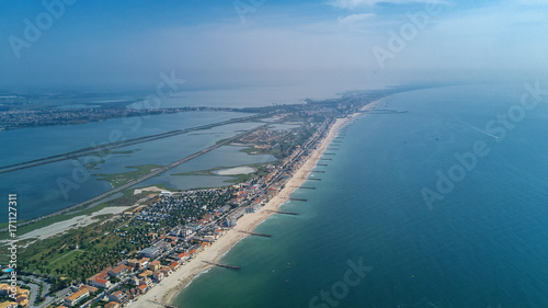 Aerial top view of beach resort town on Mediterranean sea from above, vacation and tourist holiday destination in France 