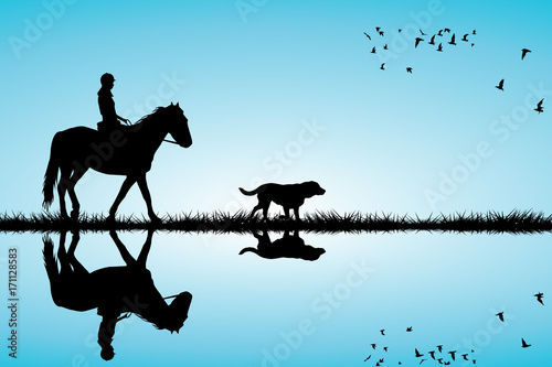 Woman riding a horse and dog