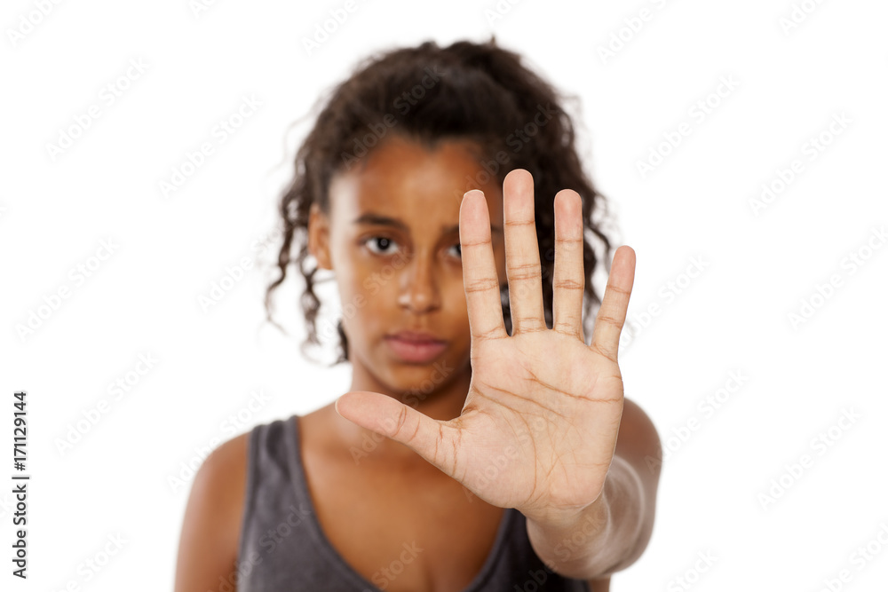 sad african girl shows a stop hand sad african girl shows a stop hand