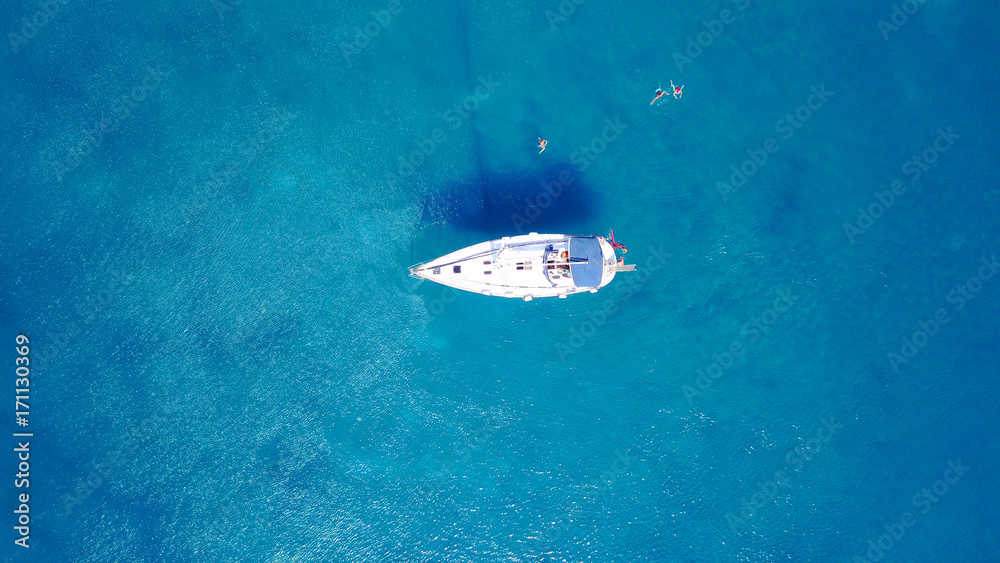 Naklejka premium August 2017: Aerial drone photo of paradise beach of Traganou with small caves and turquoise clear waters, Rhodes island, Dodecanese, Aegean, Greece