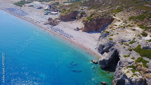 August 2017: Aerial drone photo of paradise beach of Traganou with small caves and turquoise clear waters, Rhodes island, Dodecanese, Aegean, Greece