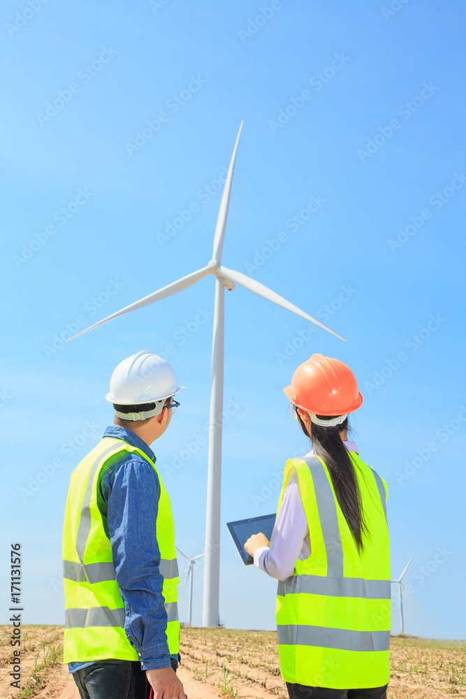Engineers working on wind turbines. Engineers working on wind turbines.