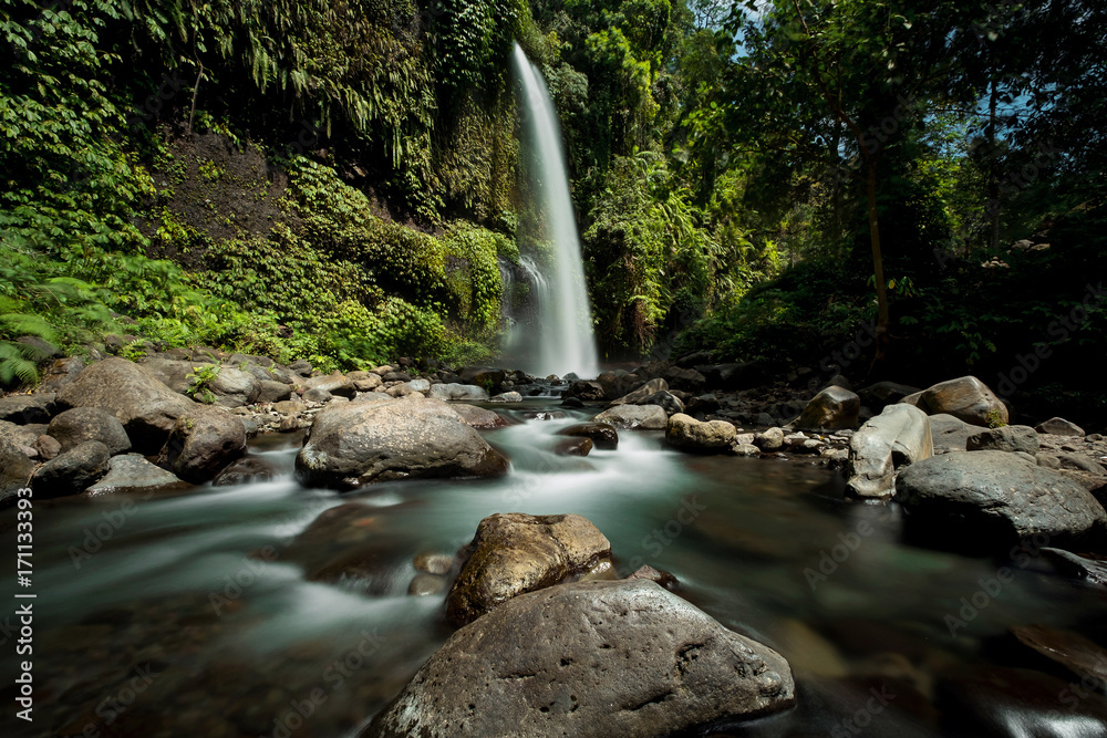 Fototapeta premium Sendang Gile waterfall is a stunning waterfall on Lombok, Indonesia. Long exposure photography.