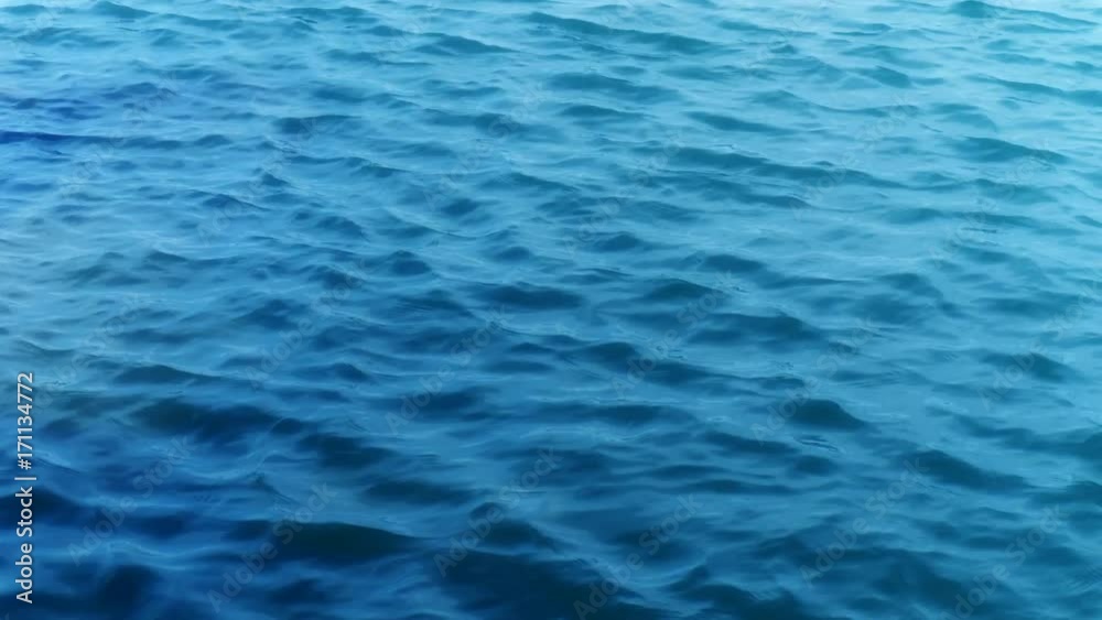 gentle waves at sea blue background