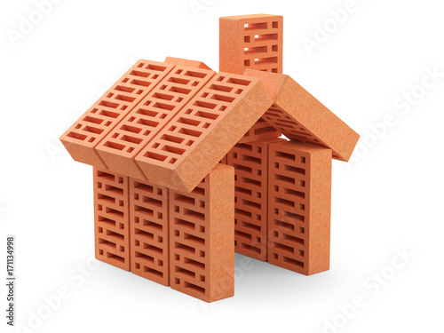 The bricks are arranged in the shape of the house. Building koncept.