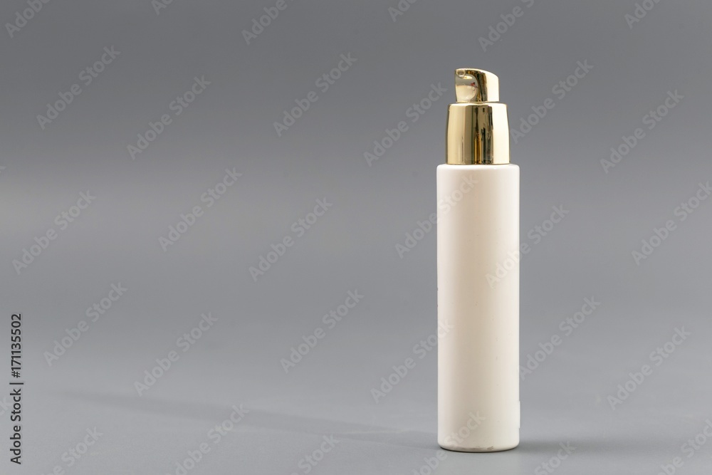 mini bottle sprayer on gray background in mini bottle sprayer on gray background in