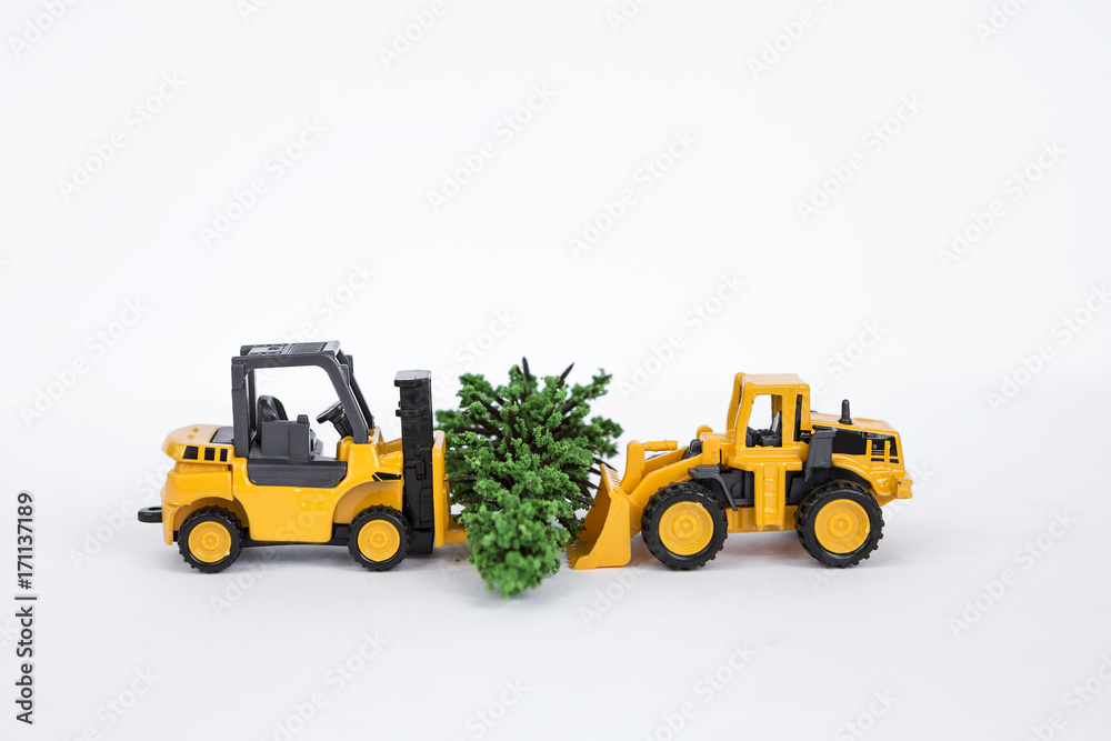 Two truck moving Christmas tree isolate on white background Two truck moving Christmas tree isolate on white background