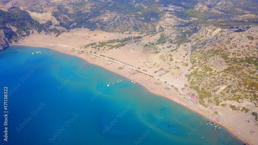 August 2017: Aerial drone photo of famous Tsabika monastery overlooking iconic Tsabika bay from the cliff with clear turquoise waters, Rhodes island, Aegean, Dodecanese, Greece