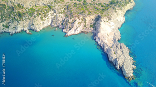 August 2017: Aerial drone photo of famous Tsabika monastery overlooking iconic Tsabika bay from the cliff with clear turquoise waters, Rhodes island, Aegean, Dodecanese, Greece photo