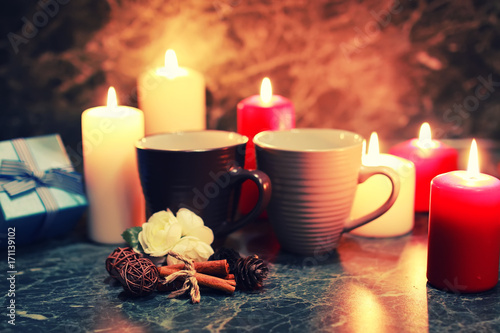 night table with mug and candle