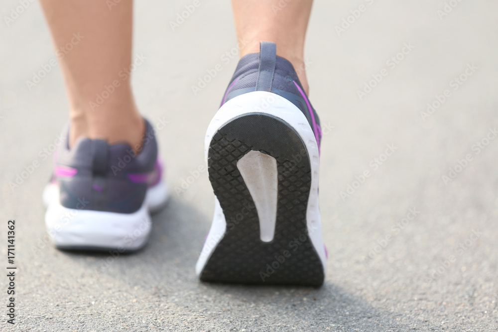 Young sporty woman running outdoor