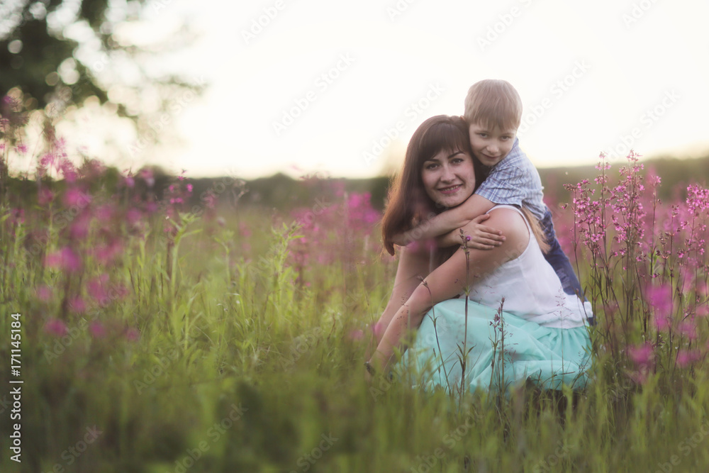 Young beautiful mother with son boy in park Young beautiful mother with son boy in park