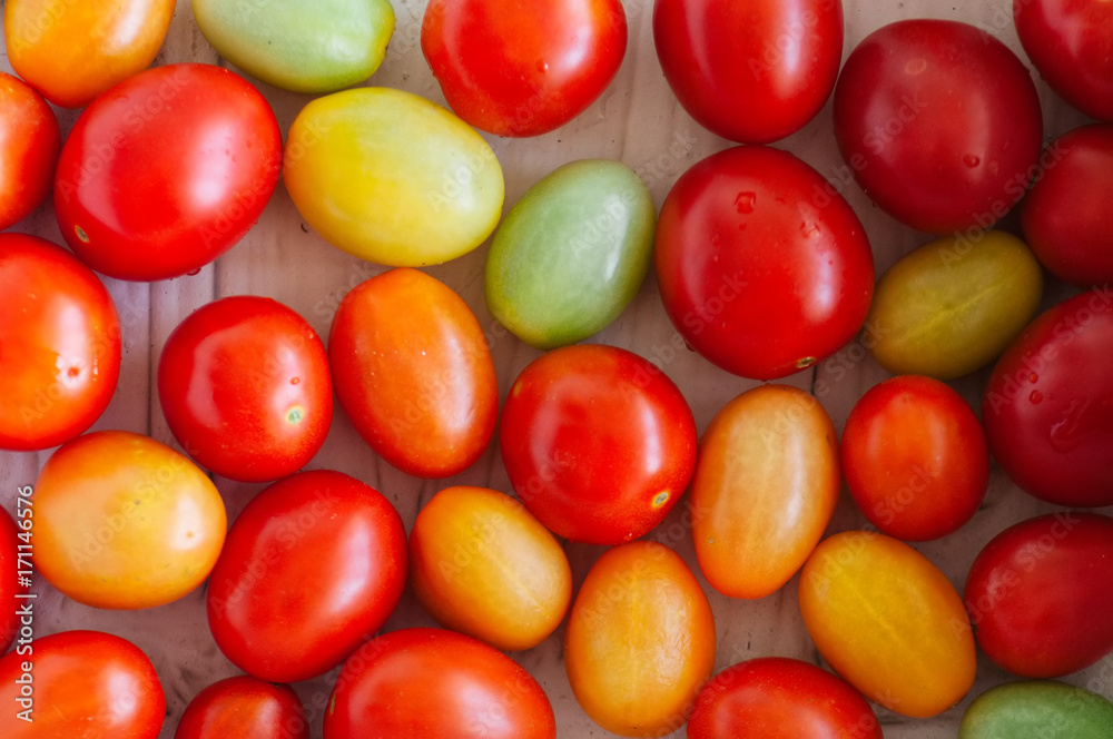 Background of bright colorful tomatoes cherry. Top view. Background of bright colorful tomatoes cherry. Top view.