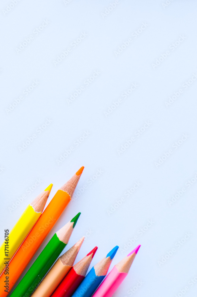 Fototapeta premium Set of colorful pencils on a white background. Close up and copy space.