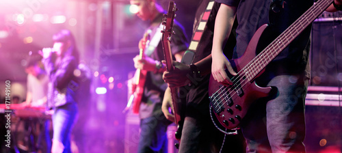 Stampa su tela Guitarists on stage for background, soft focus and blur concept