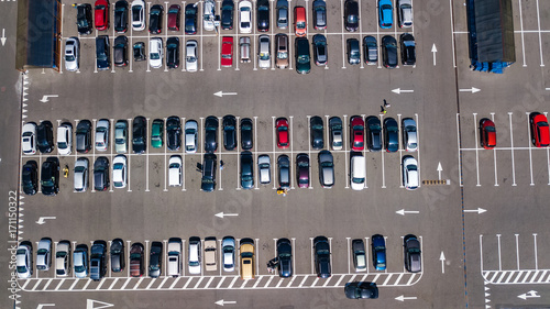 Aerial top view of parking lot with many cars from above, transportation and urban concept 