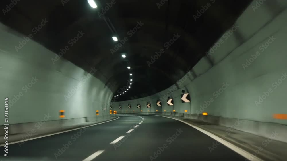 the car rides through the tunnel