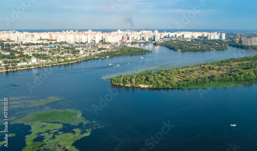 Aerial top view of Darnitsky bridge, Dnieper river and cityscape from above, city of Kiev, Ukraine 