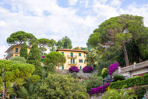 Beautiful daylight view to a house on mountains near trees and blue sky. Santa Margherita Ligure city, Italy