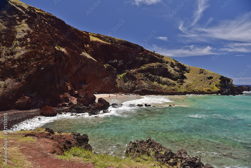 Easter Island rocky coast line under blue sky Easter Island rocky coast line under blue sky