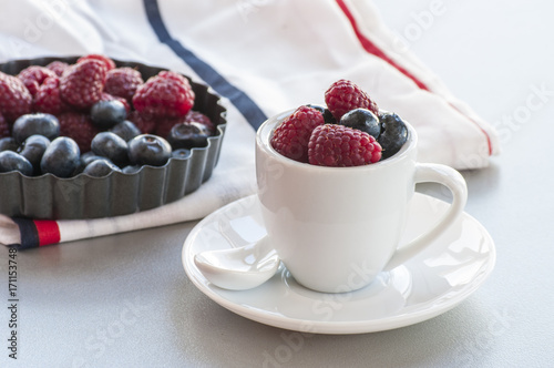 Healthy mixed fruit and ingredients with strawberry, raspberry, blueberry, blackberry from top view